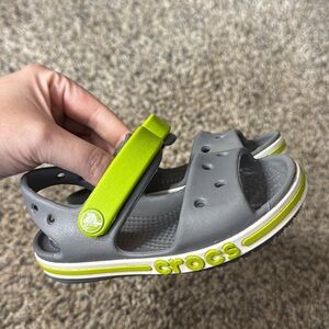 CROCS Kids Gray Sandals with Green Accents